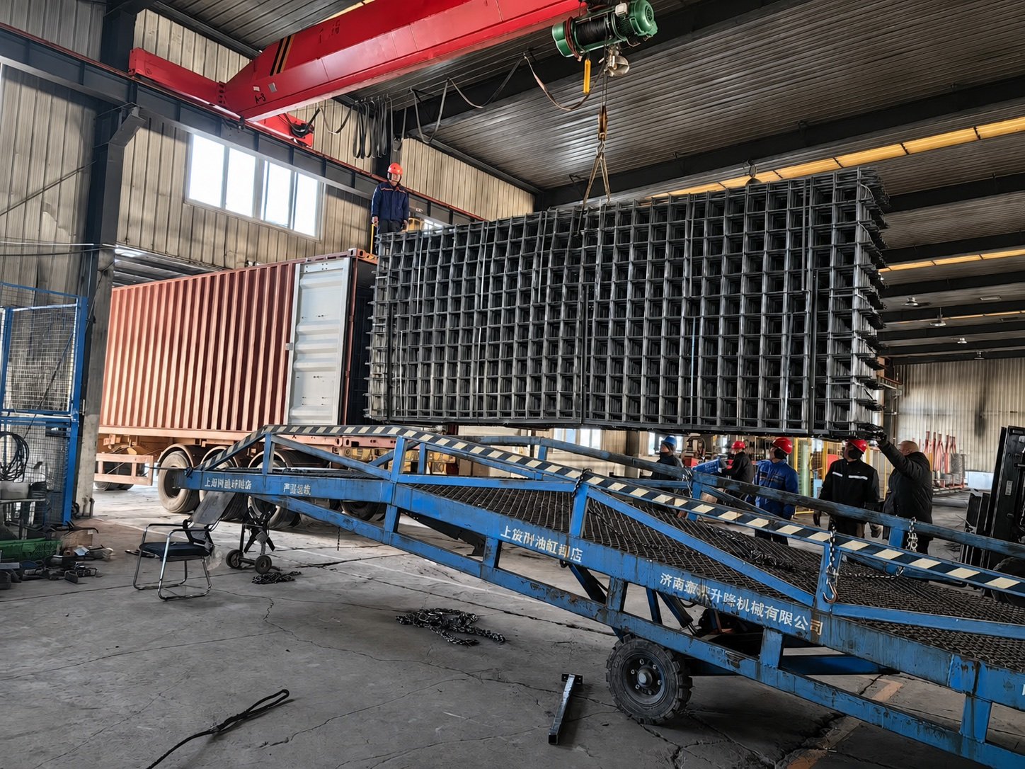 Reinforcing mesh bundle being handled for loading
