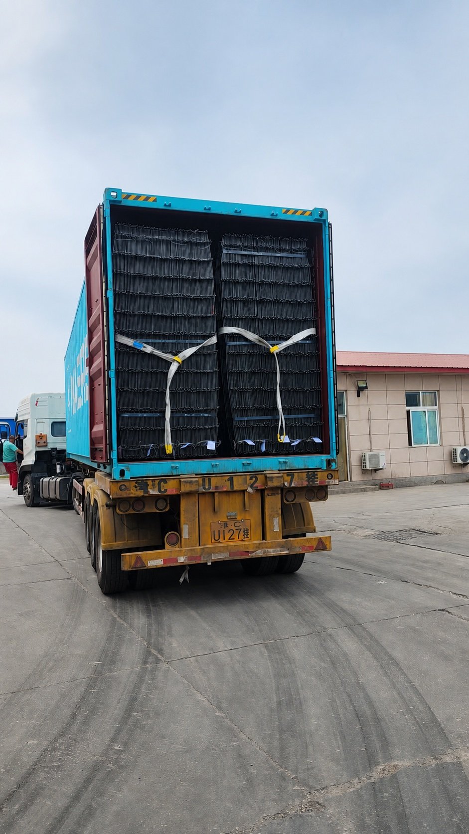 Reinforcing mesh loaded in shipping container